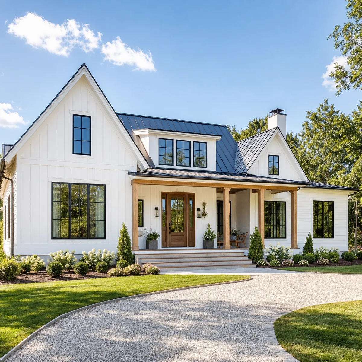 White farmhouse exterior with black windows and a timber entry porch