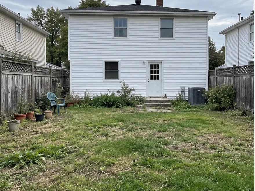 Backyard makeover before AI landscape design concept